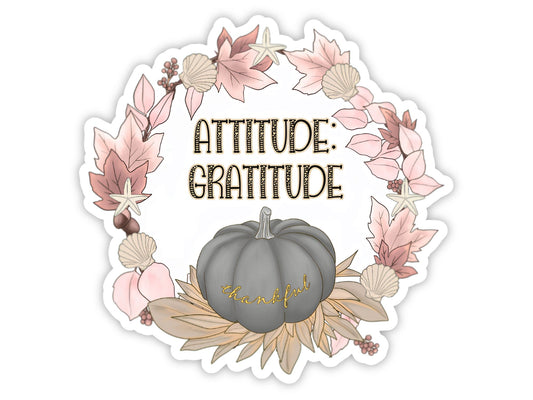 "Attitude: Gratitude" thankful sticker. A wreath of pink autumn leaves, seashells, and starfish around the words, with a soft gray pumpkin that says "thankful" in gold script