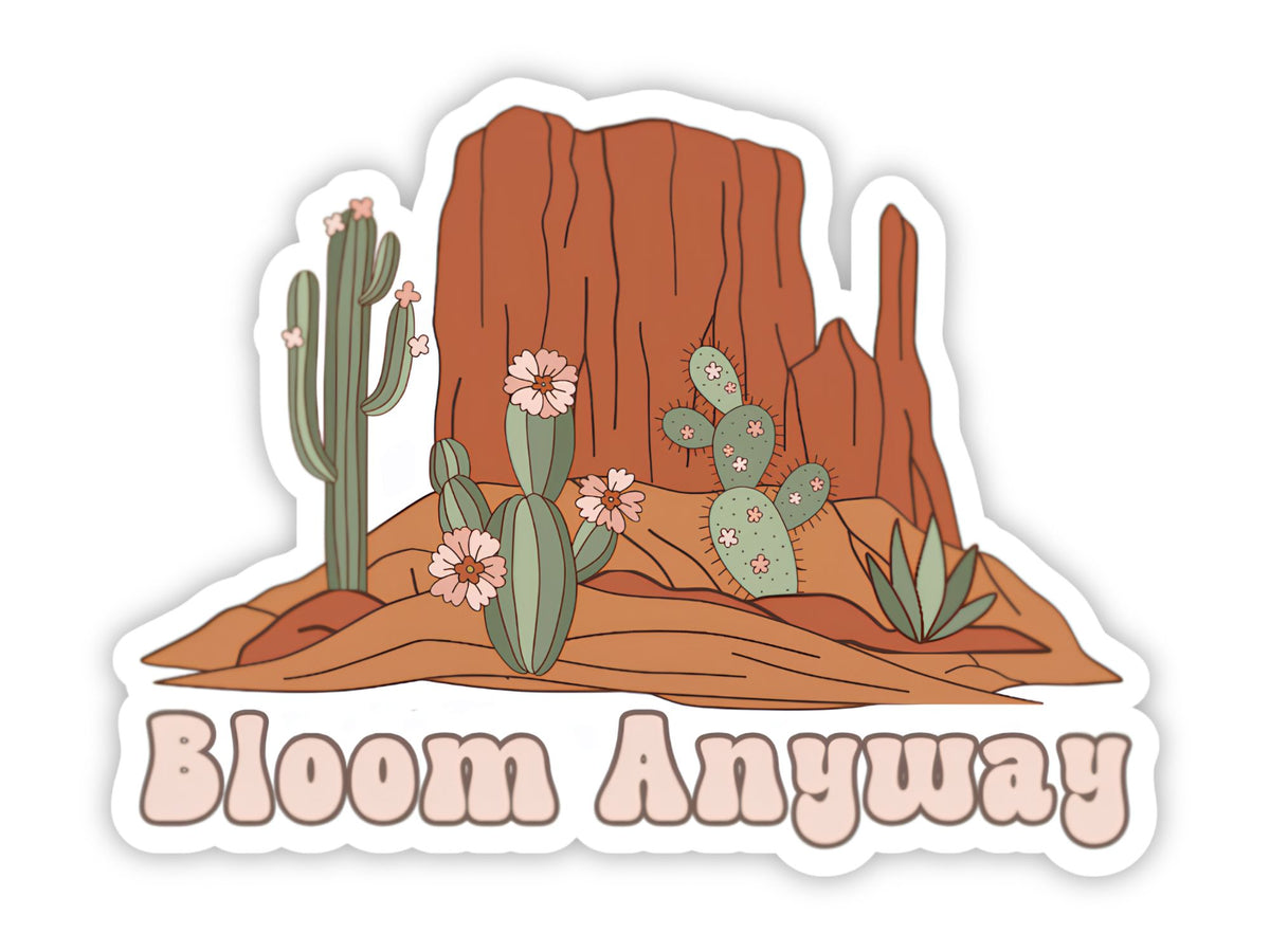 "Bloom Anyway" flower sticker. Red rock buttes with a blooming saguaro, flowering prickly pear, and agave, with the saying in retro pink bubble letters