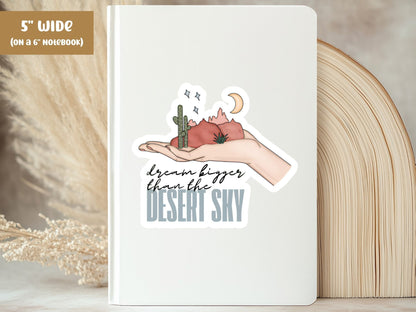 "Dream Bigger Than the Desert Sky" dream big sticker, 5-inch size, on the cover of a white 6-inch notebook