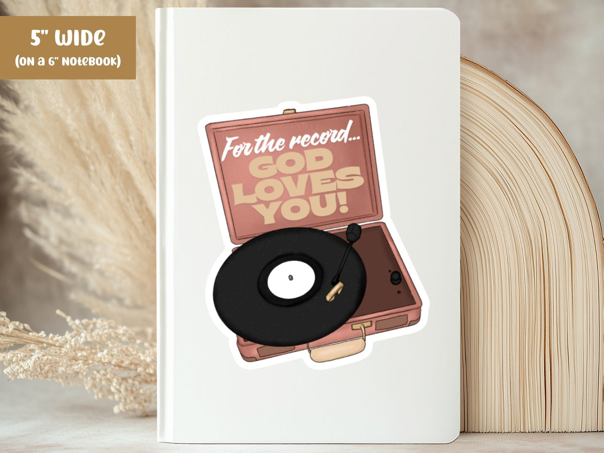 "For the Record, God Loves You" God loves you sticker, 5-inch size, on the cover of a white 6-inch notebook