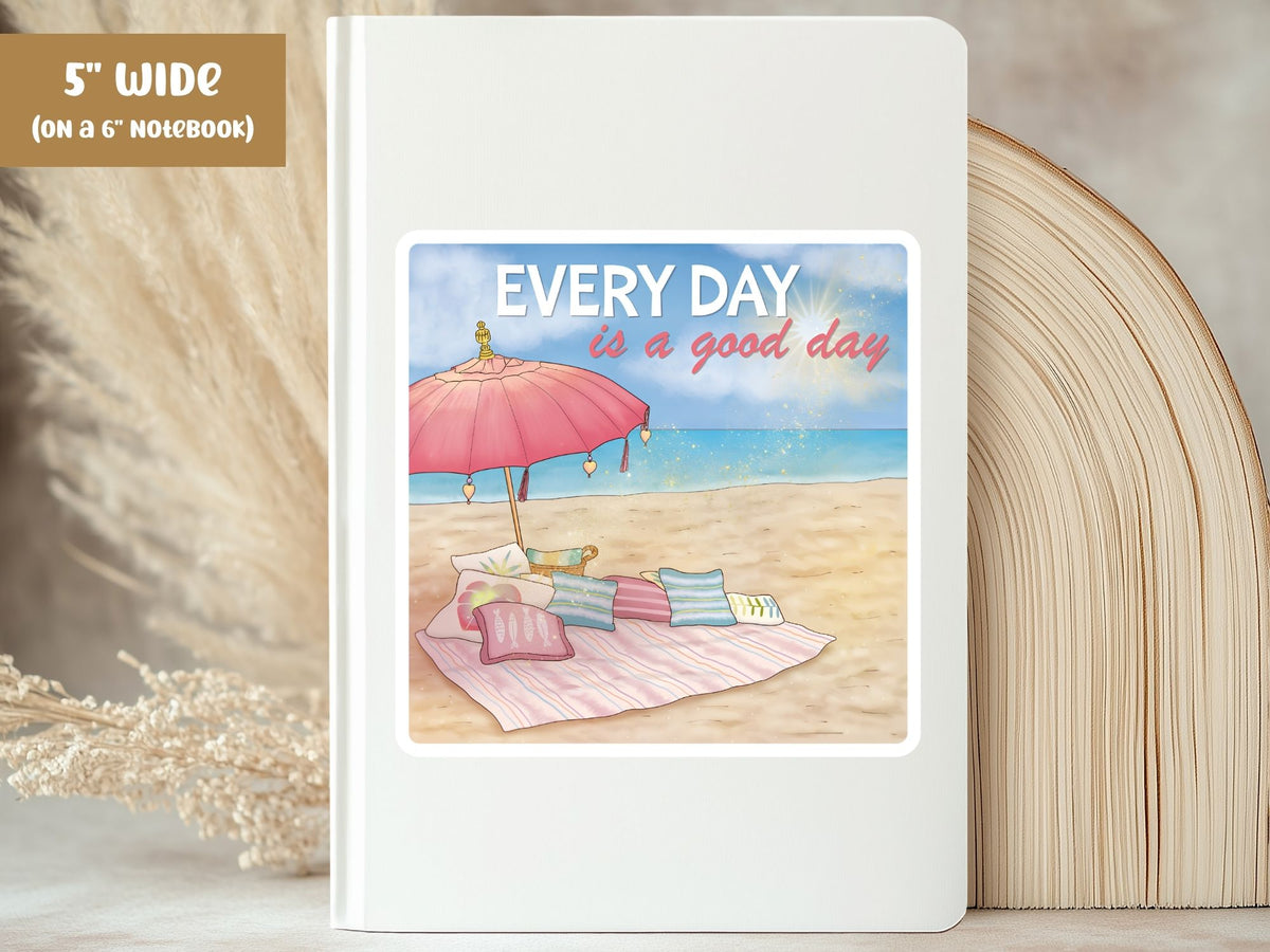 "Every Day is a Good Day" beach positivity sticker, 5-inch size, on the cover of a white 6-inch notebook