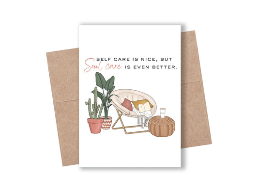 Christian card with an illustrated cozy papasan chair, cactus, coffee, and open Bible, reading: "Self care is nice, but soul care is even better."