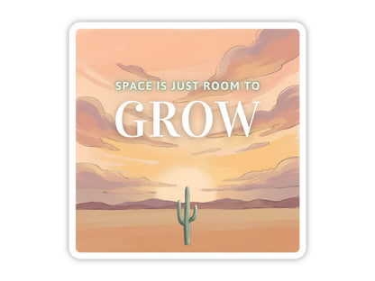 "Space Is Just Room to Grow" desert cactus sticker. A lone saguaro in open desert under a gold and lavender sunset sky