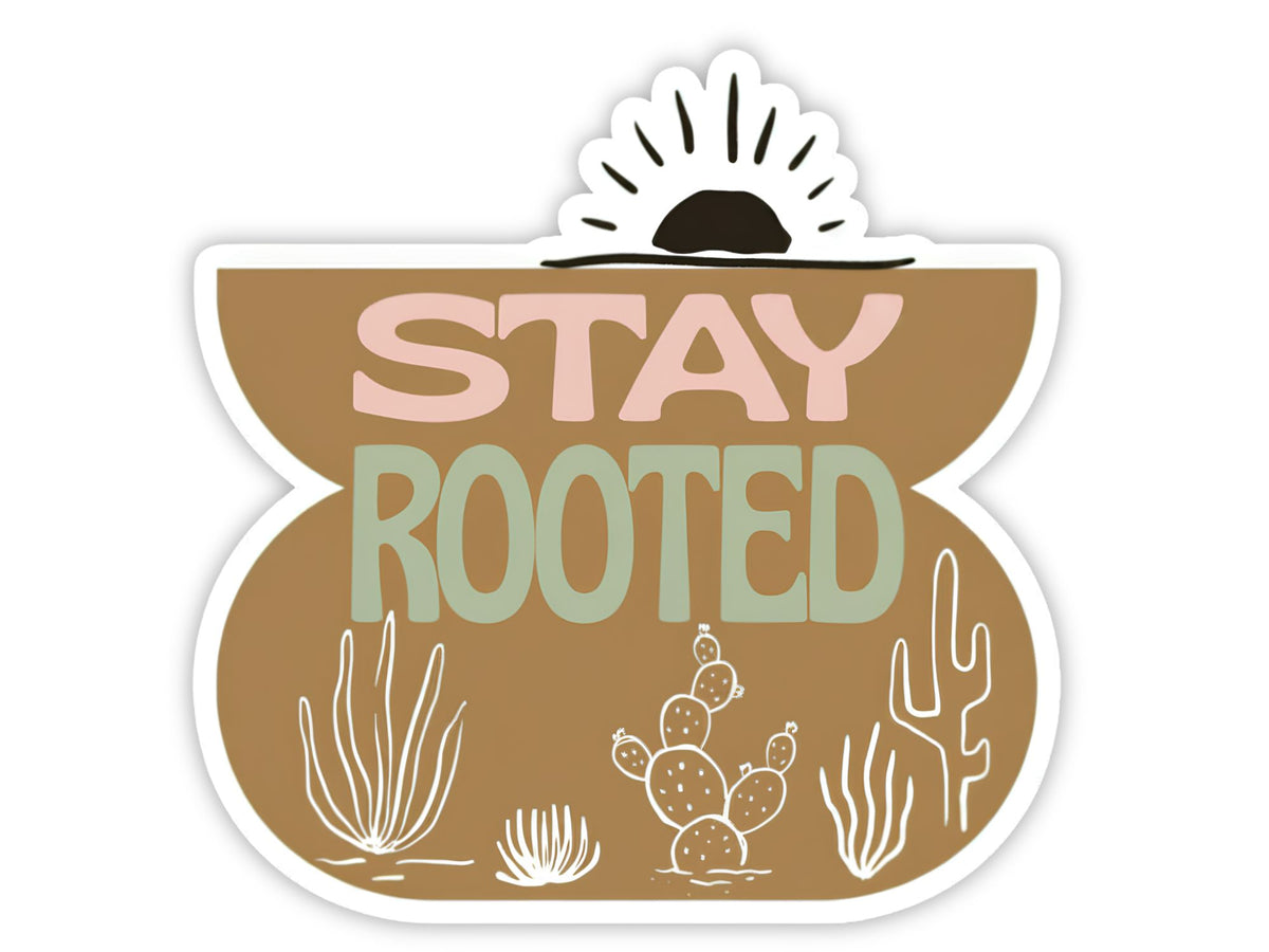 "Stay Rooted" plant sticker. A tan desert scene with white line-art cactus, ocotillo, and prickly pear along the bottom and a sunrise arching over the top