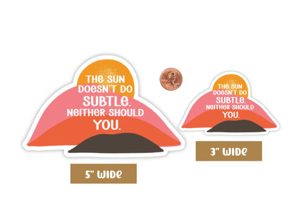 "The Sun Doesn't Do Subtle. Neither Should You." confidence sticker in 5-inch and 3-inch sizes with a penny for scale