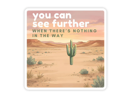 "You Can See Further When There's Nothing in the Way" you are enough sticker. A lone saguaro in a wide open desert with scrub brush and red mesas under a golden sunset